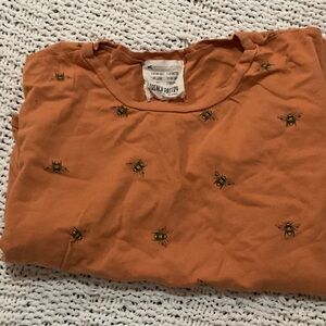 french pastry orange tee with bee motif